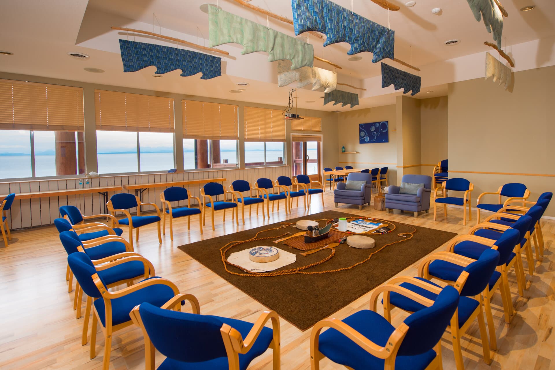 Ocean-view meeting room arranged for a group discussion