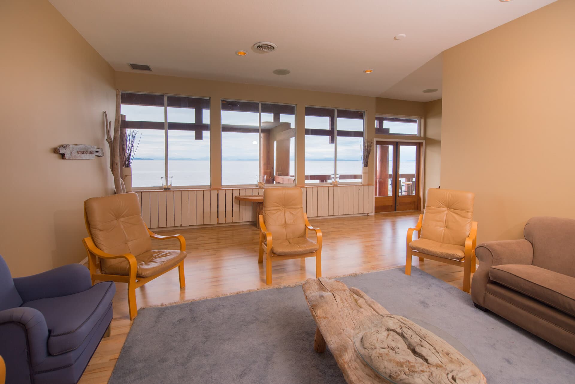 Group lounge with comfortable seating and ocean-facing windows
