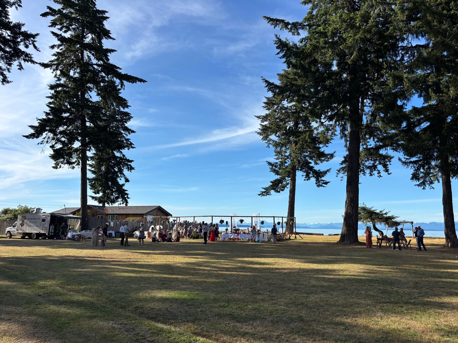 Wedding venue with ocean and evergreen trees