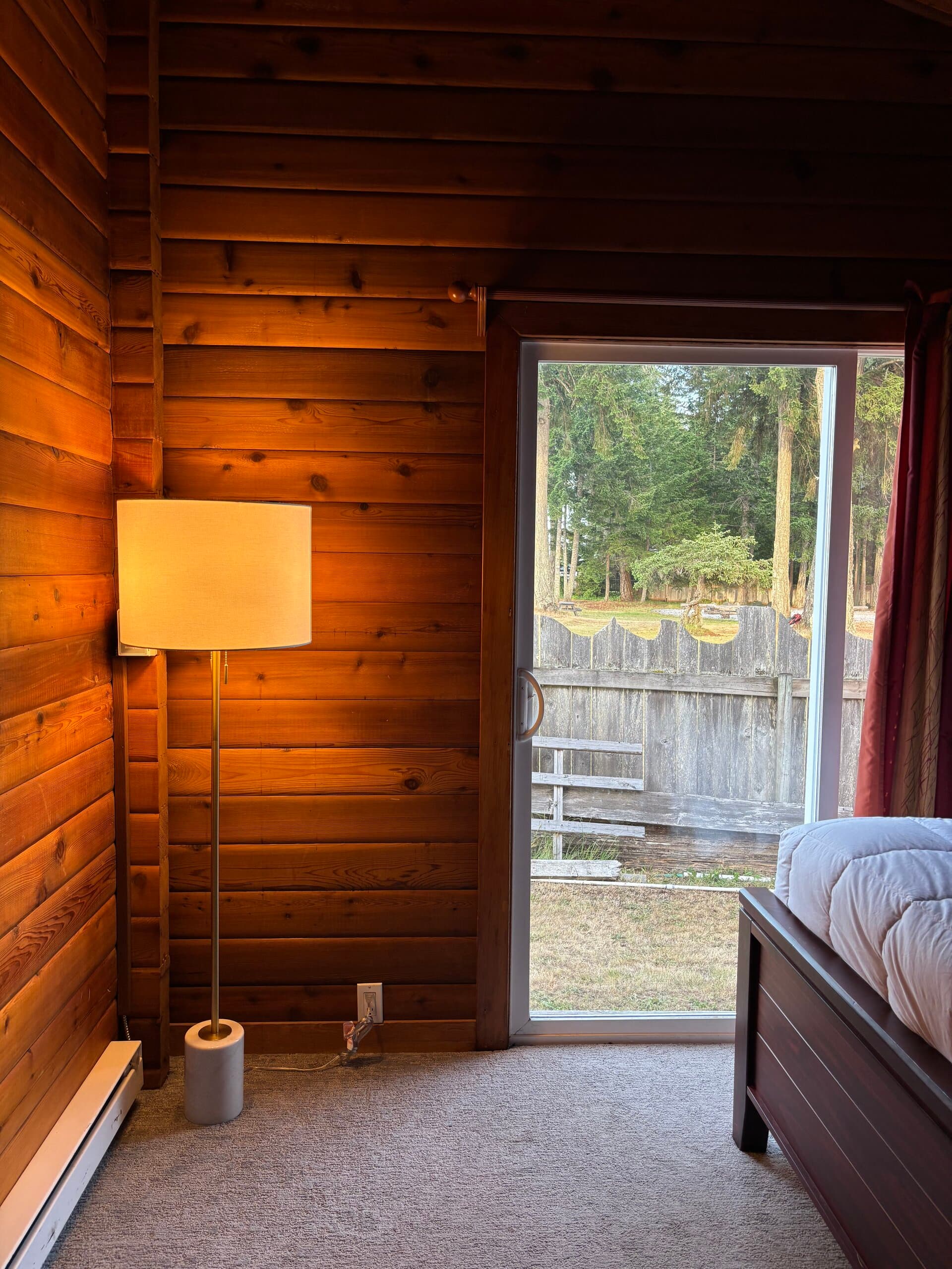 Bedroom with natural wood wall finishes