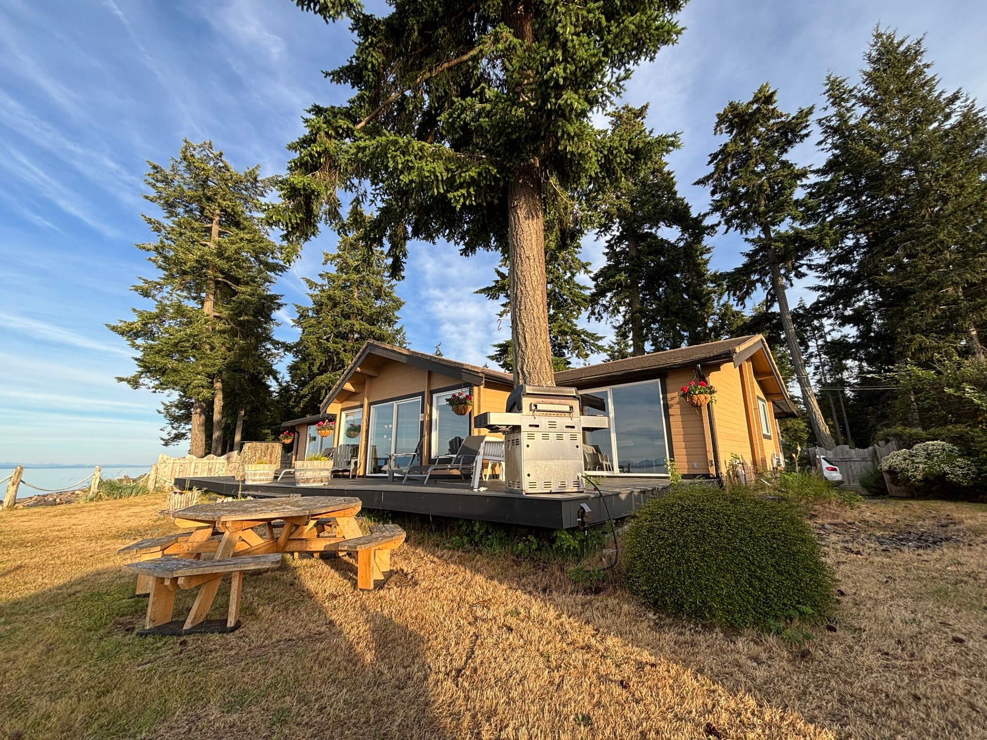 Ocean House exterior with deck, BBQ, picnic table, and Pacific views