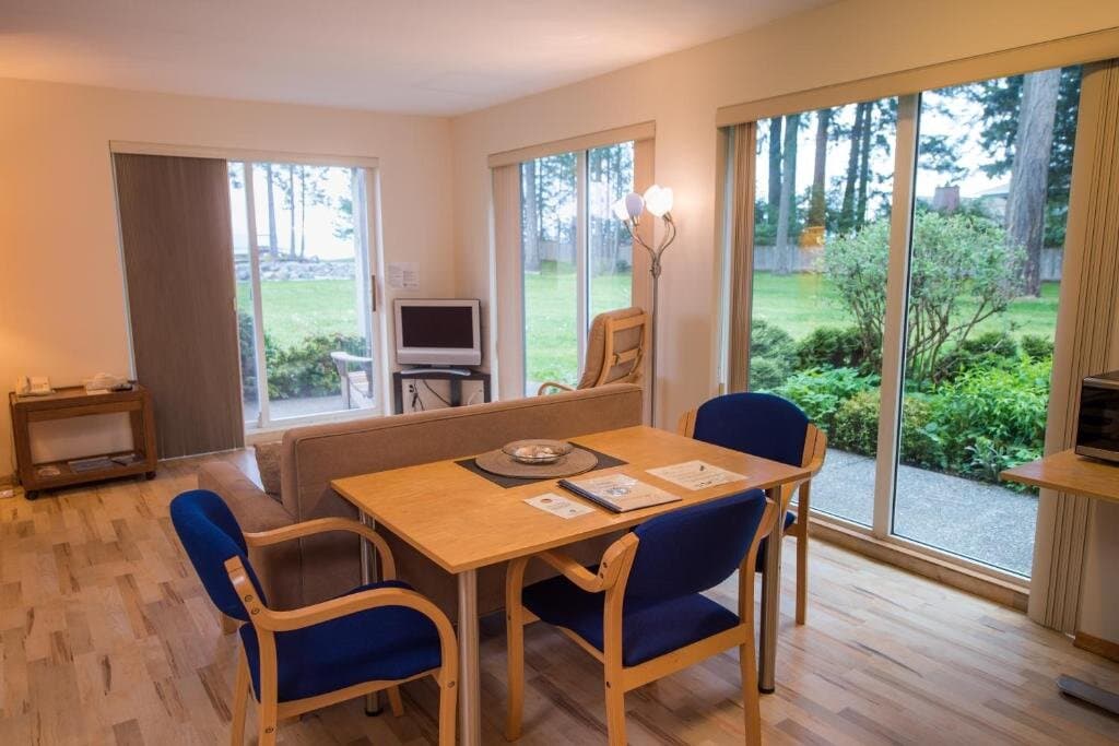 Full kitchen with refrigerator, range, and dining area