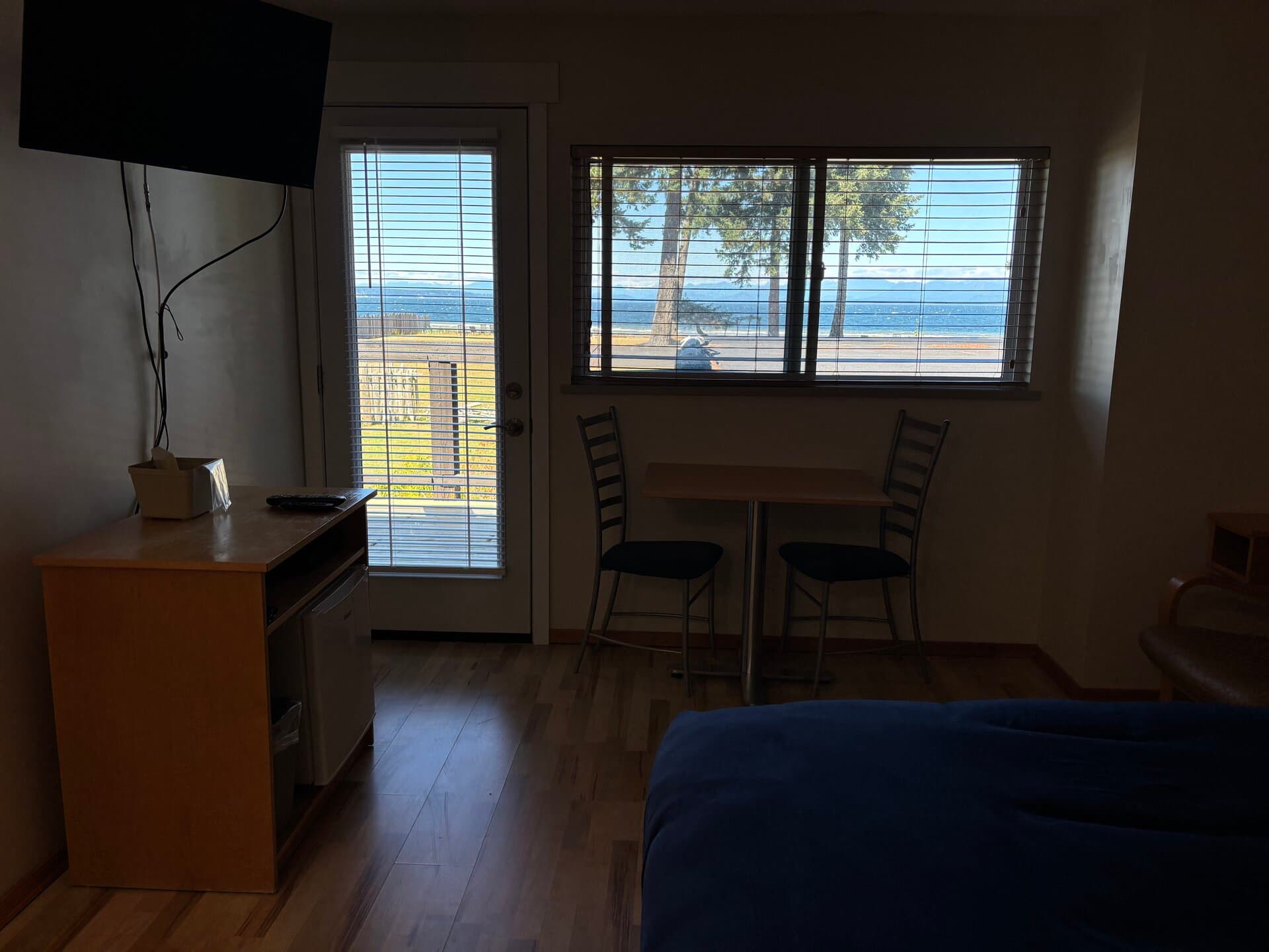 Ocean view through the window and balcony door from the queen room