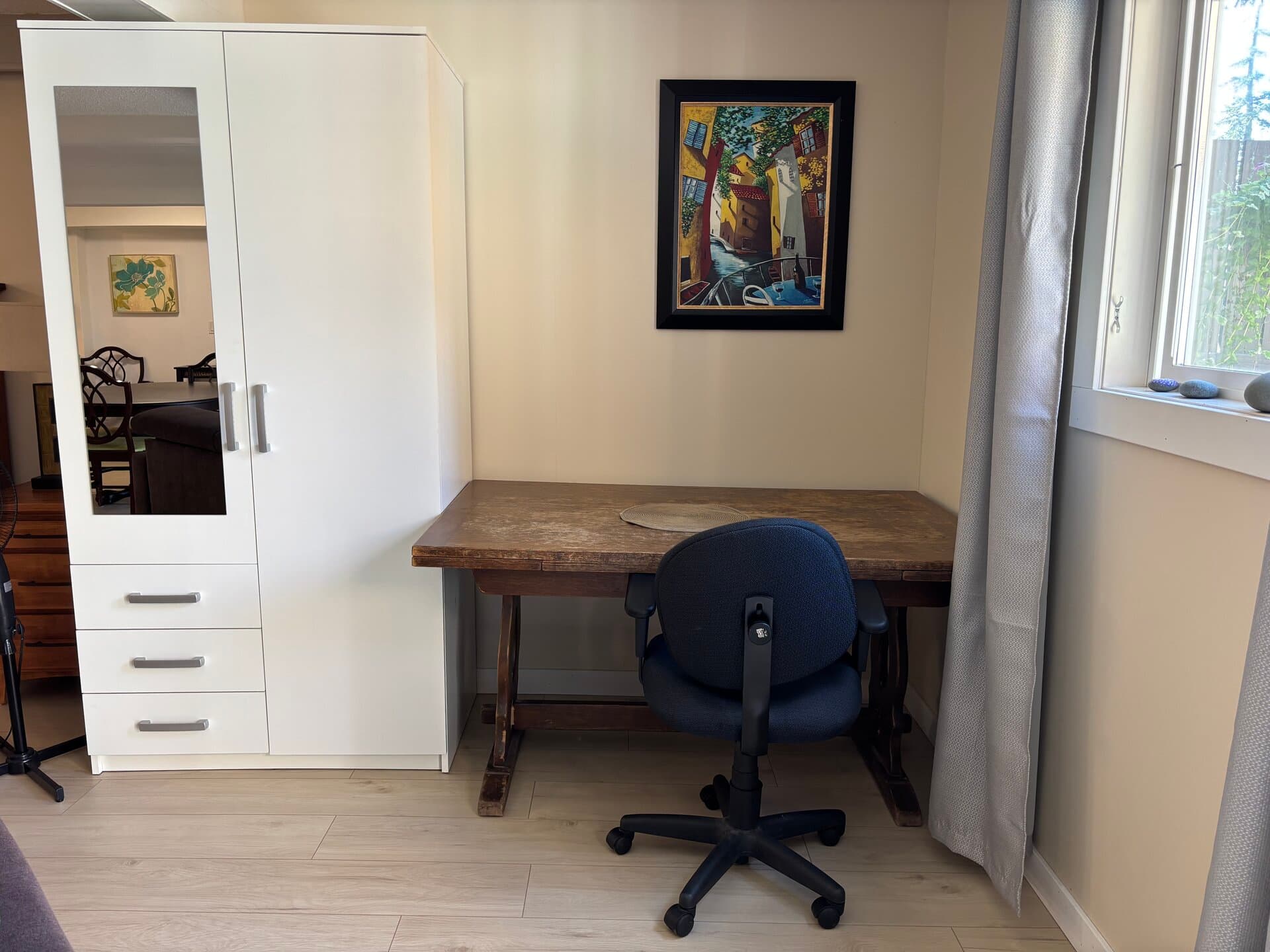Dedicated workspace with wardrobe and garden window