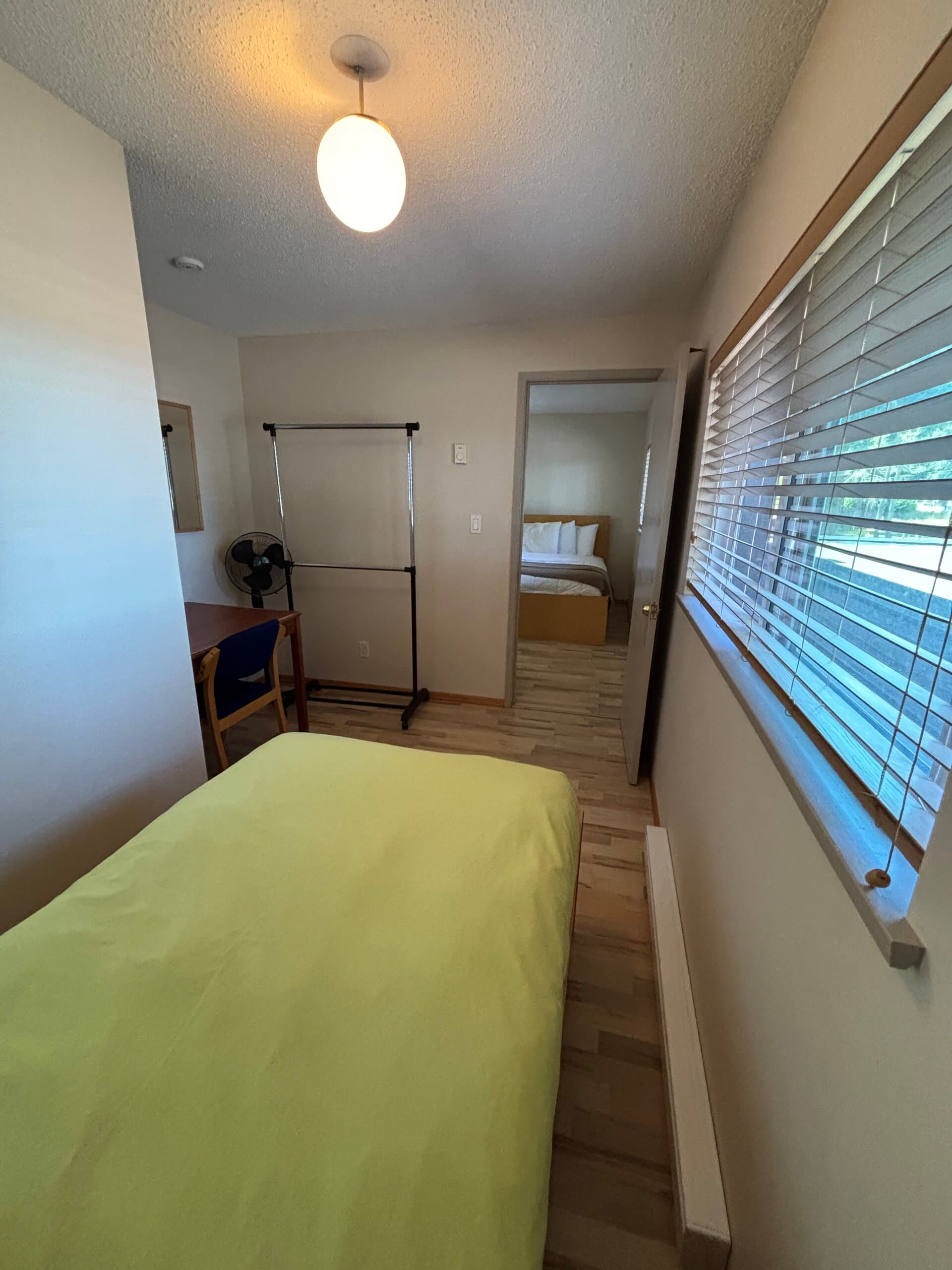 Single bed room looking through to the double bed room