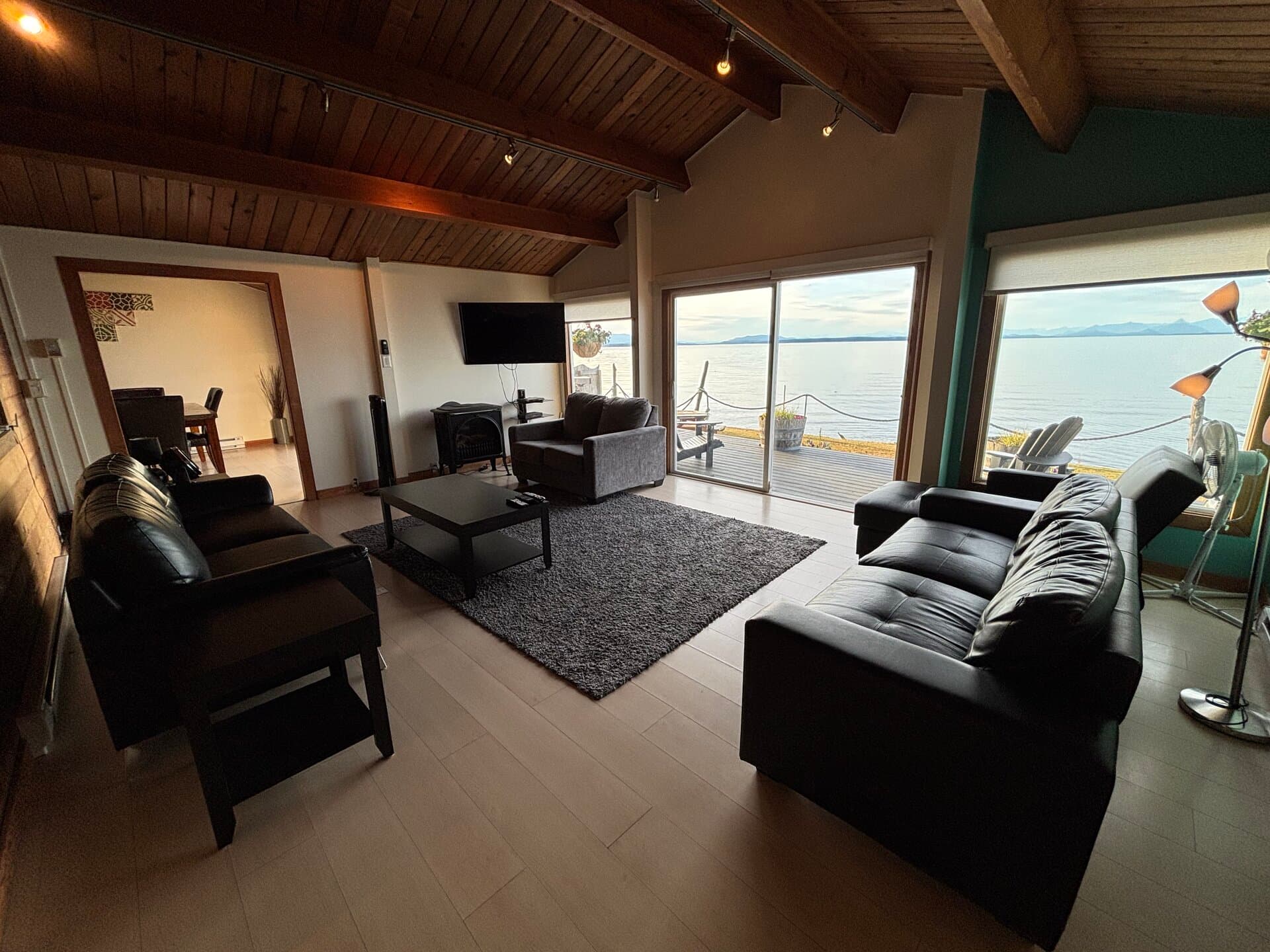 Living room with leather sofas and sweeping ocean panorama