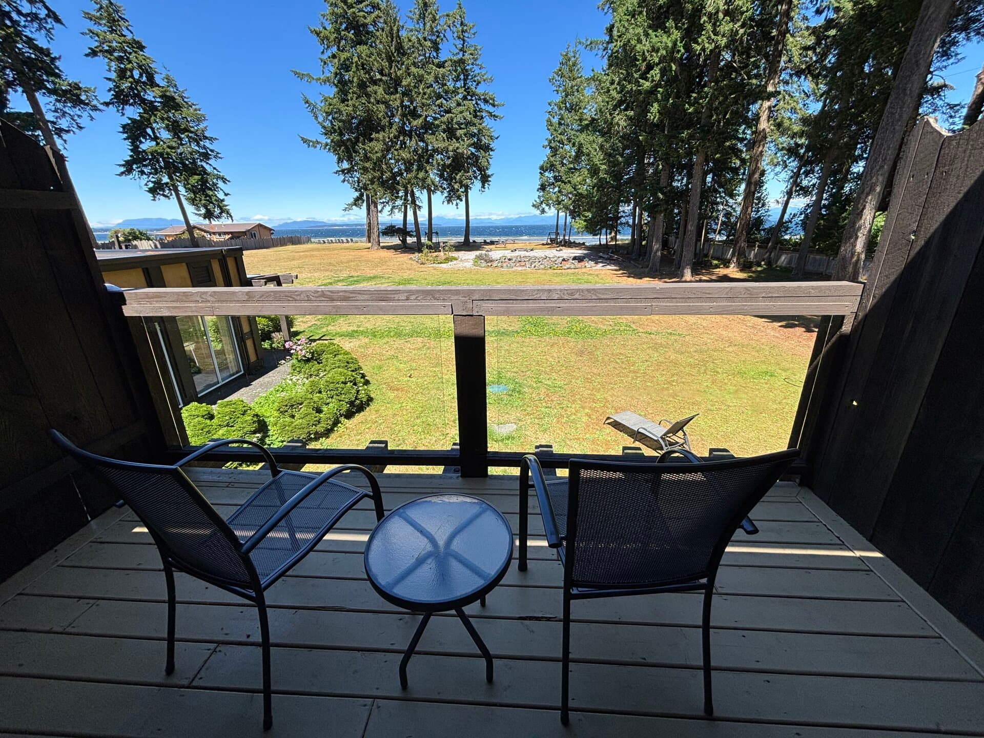 Private balcony with bistro set overlooking the Pacific and mountains