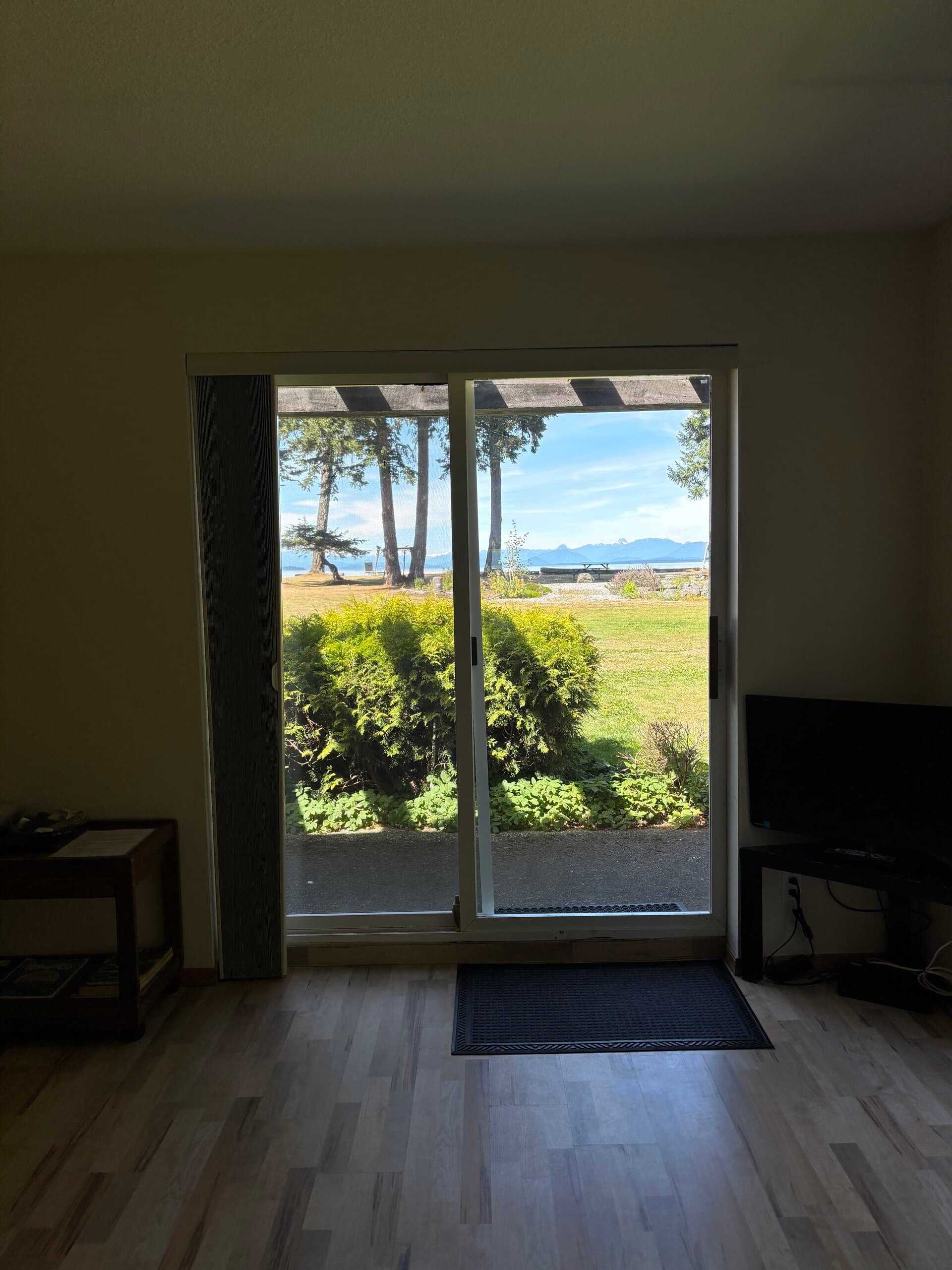 Ocean and mountain views through sliding doors from the living area