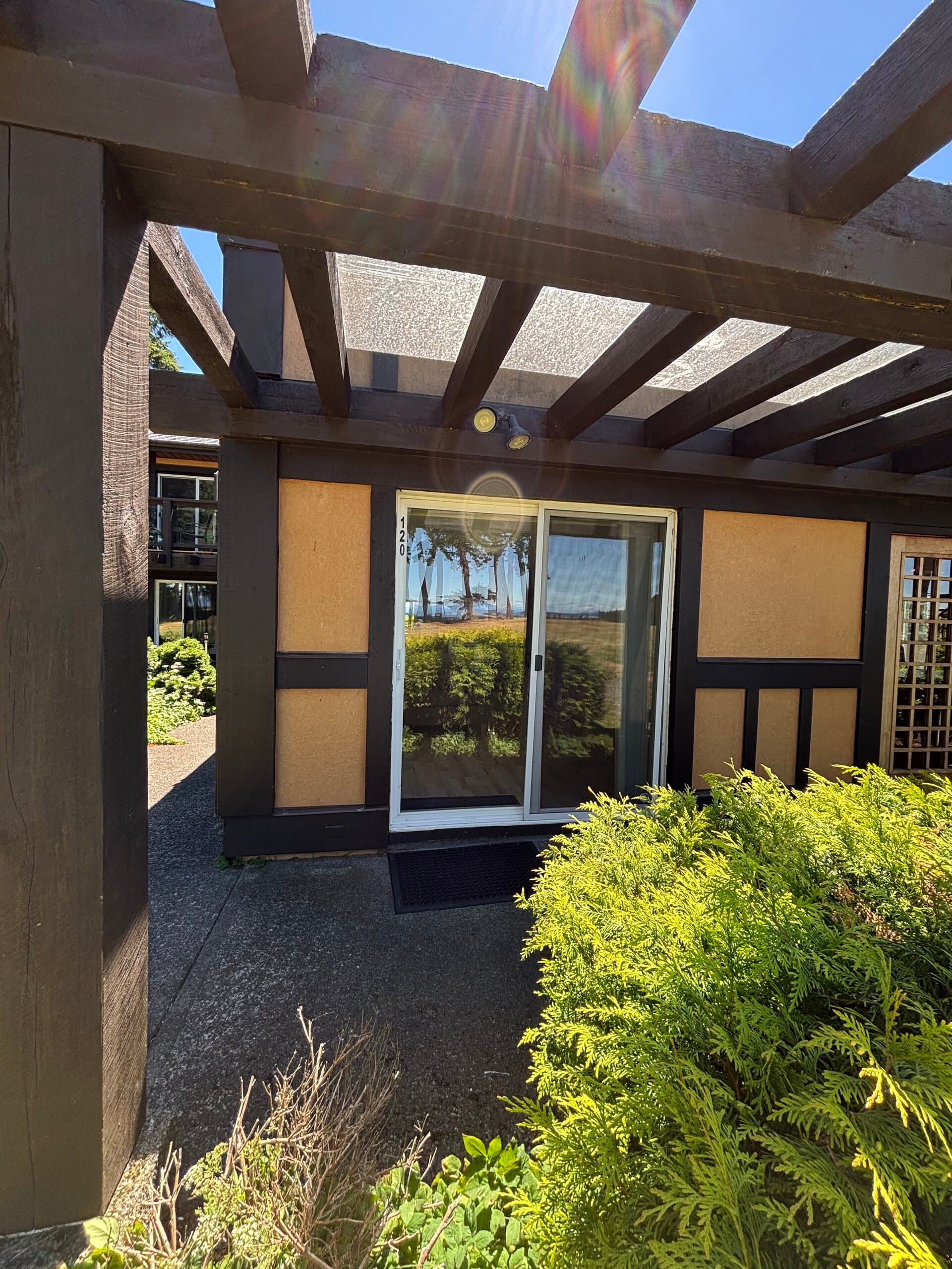Ground-floor suite entrance under a pergola